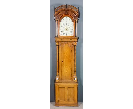 An early 19th Century ornate oak longcase clock by Thomas Ross of Crowle, dated 1801, the 12ins arched painted dial with Roma