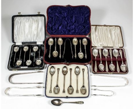 A set of six late Victorian silver gilt "Apostle" pattern teaspoons with spiral twist handles and pair of matching sugar tong