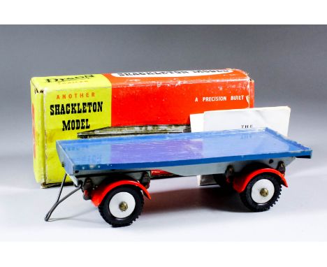 A Shackleton Toys tinplate model "Eight ton Dyson trailer", painted in blue, and red, with maintenance instructions, and orig