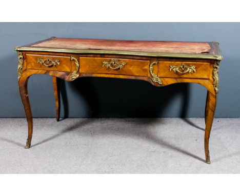 A late 18th/early 19th Century French kingwood and gilt brass mounted rectangular Bureau Plat of "Louis XV" design, the whole