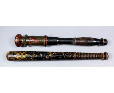A Victorian truncheon with "VR" in gilt over a gilt and black coat of arms (Royston?) over "GCS", with ribbed handle, 16.25in