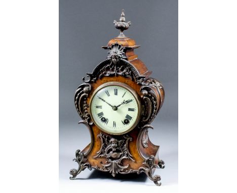 A late 19th/early 20th Century German stained wood and patinated brass mounted mantel clock of "Louis XV" design, No. 40909, 