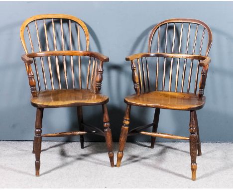 Two 19th Century "Nottinghamshire" ash and elm seated stick back Windsor armchairs with two tier backs, on turned legs and H-