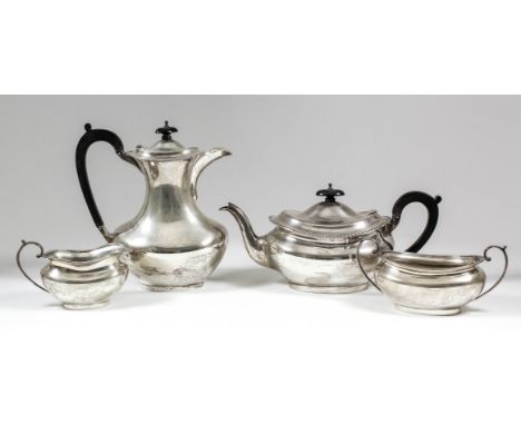 A George V silver four piece tea service, the plain oval squat bodies with gadroon mounts to rim, comprising - teapot, 5.25in