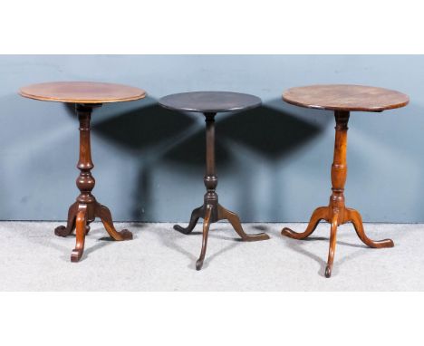 A mahogany circular tripod occasional table, on turned central column and cabriole legs, 18ins diameter x 27ins high, a simil