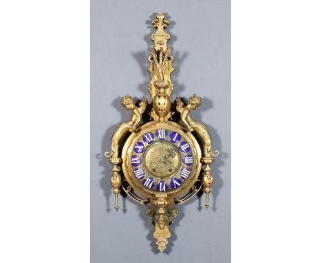 A late 19th Century French gilt brass and enamel Cartel clock, the 9ins diameter domed gilt brass dial with raised enamel Rom
