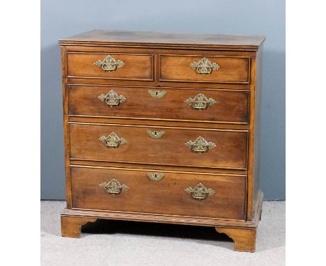 A George III mahogany chest with triple moulded edge to top, fitted two short and three long drawers with later brass handles