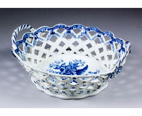An 18th Century Worcester blue and white porcelain oval two-handled basket printed with the "Pinecone" pattern, the sides pie