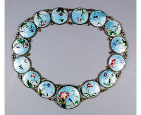 An early 20th Century Japanese plated and enamel belt, the fifteen circular panels enamelled with flowers and birds, on a blu