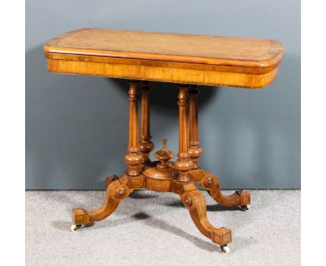 A Victorian satinwood rectangular card table, the red baize lined folding top with bowed ends, moulded edge and crossbanded i