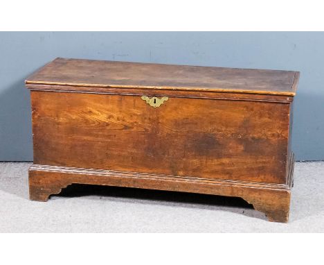 An 18th Century elm plank coffer with moulded edge to lid and on bracket feet, 40ins wide x 16ins deep x 20ins high