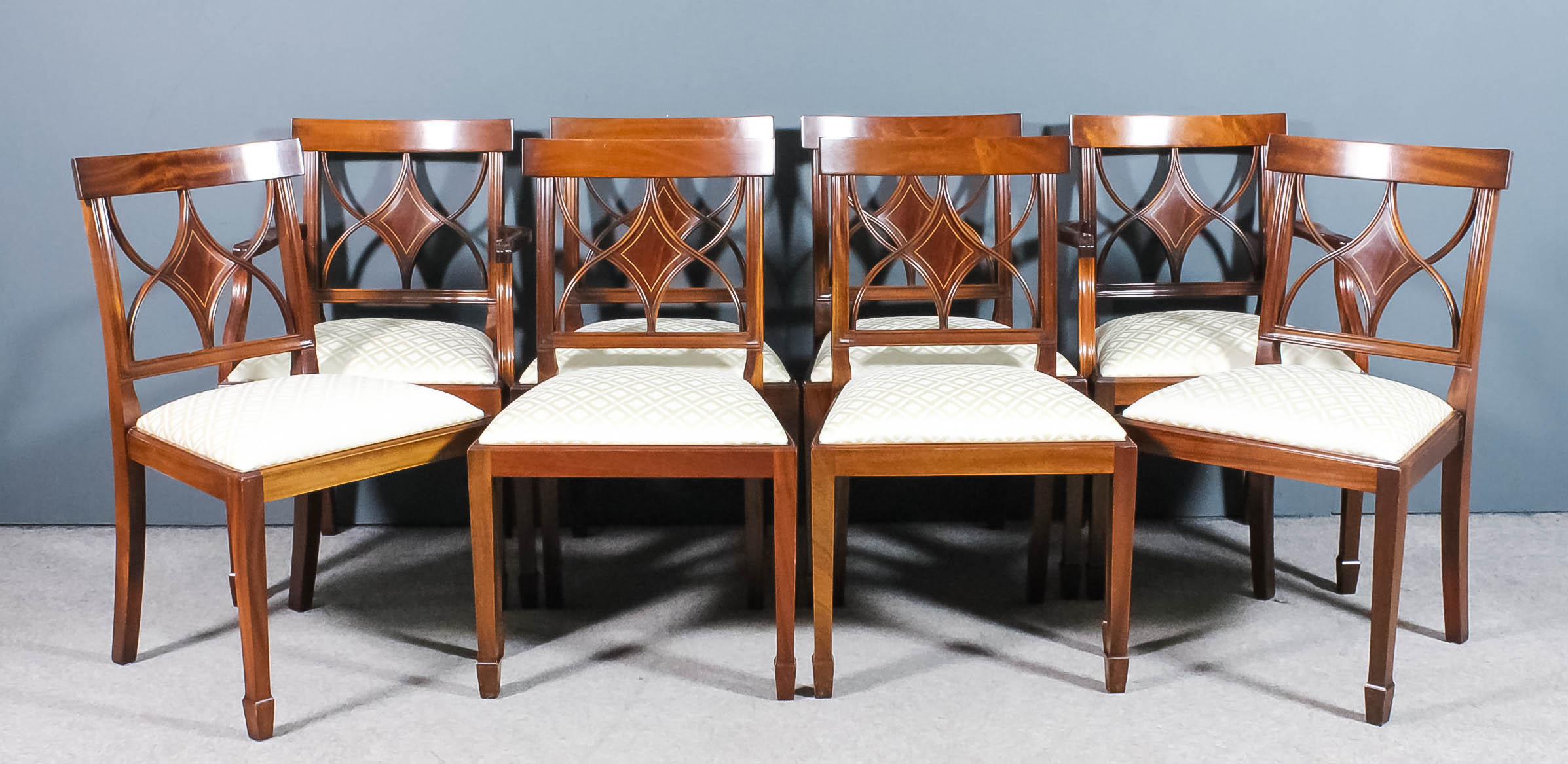 A set of eight modern mahogany dining chairs by Charles Barr Furniture