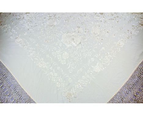 A Chinese cream silk shawl, finely embroidered with scroll and leaf ornament, 48ins (122cm) square, and with deep fringed bor