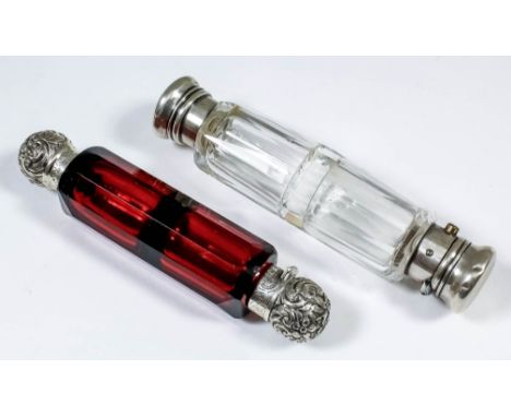 A Victorian silvery metal mounted and ruby glass double ended scent bottle with panel cut body, the screw on and folding moun