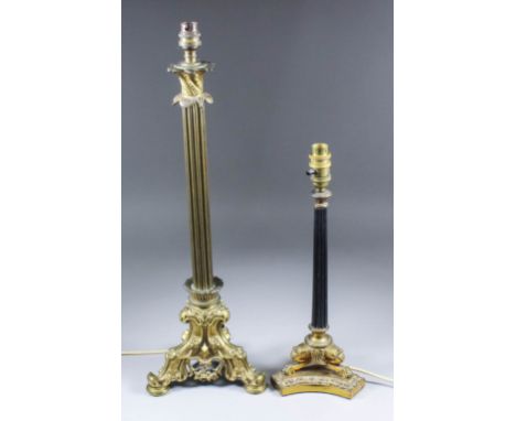A 19th Century gilt brass candlestick with fluted column, standing on a cast triangular base, 23ins high, and a gilt brass ca