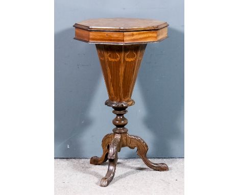 A mahogany and marquetry octagonal work table in the "Victorian" style, the lifting top inlaid with shaped cartouches and lea