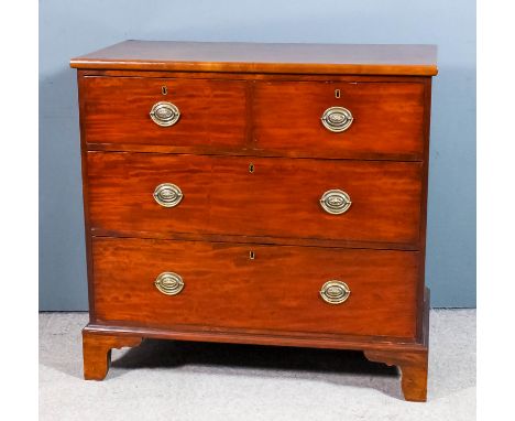 A Victorian mahogany chest with slightly rounded edge to top, fitted two short and two long drawers, on bracket feet, 37.5ins