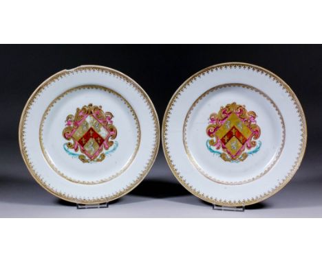 A pair of Chinese export Armorial porcelain plates, the centres painted and decorated in gilt with a crest of three lions ram