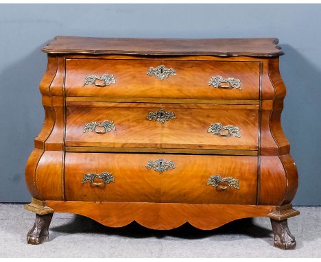 A Dutch walnut bombe fronted commode of "18th Century" design, the shaped top with moulded edge, fitted three long drawers wi