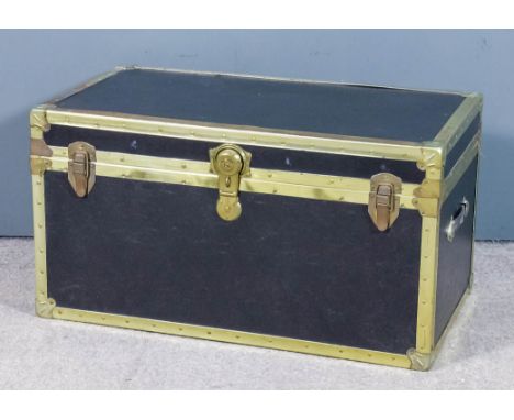 An early 20th Century metal bound and black leather cloth two-handled cabin trunk, 35.25ins wide x 20ins deep x 19ins high (l