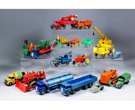 A collection of Dinky diecast model vehicles, including - "Guy" flatbed truck in blue and red, ",Sommer" recovery truck, in b