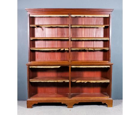 A late Victorian mahogany open front two tier bookcase with moulded cornice, fitted eight adjustable shelves with leather she