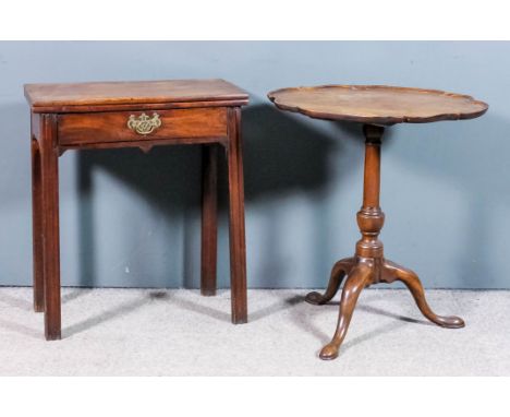 A mahogany oval tray top tripod table of shaped and moulded outline, on 18th Century base with turned column and cabriole leg