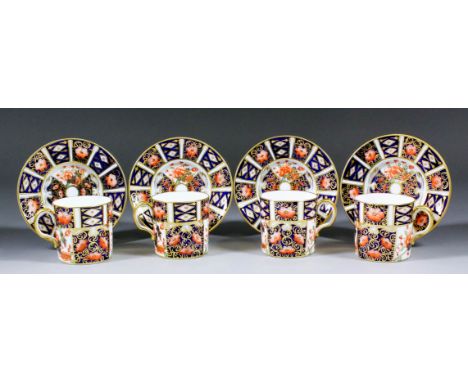 Seven Royal Crown Derby bone china "Imari" pattern coffee cans and nine saucers (pattern No. 9571)