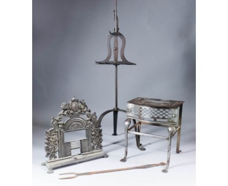 An 18th/19th Century wrought iron adjustable toasting stand on high tripod base, 33.75ins high, a late Georgian steel footman