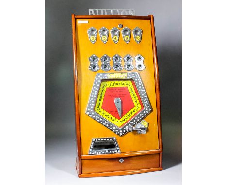 A 1970s Bryan's "Bullions" mahogany finish cased "Coin-in-the-Slot" gaming machine (to take 2p coin), the front with five num