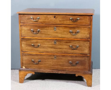 A George III mahogany chest with moulded edge to top, fitted four long graduated drawers with brass swan neck handles, on bra