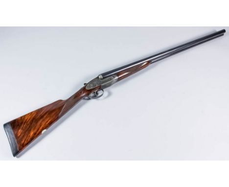 An immaculate 12 bore side by side shotgun by James Purdy of London, Serial No. 23593, the 27ins blued steel barrels with pla