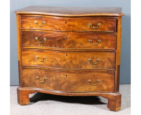 A George III mahogany serpentine fronted chest, the top inlaid with stringings and crossbanded, fitted four long graduated dr