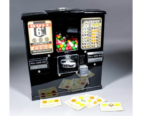 A 1960s American "Sixpence-in-the-Slot" wall mounted jackpot quiz bubble gum vending machine issuing quiz cards, the front wi