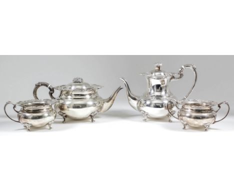 An Elizabeth II silver four piece tea and coffee service of bulbous form, the shaped and moulded rims cast with floral and le