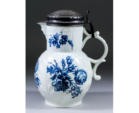 An 18th Century Worcester blue and white porcelain mask jug printed with the "Natural Sprays Group" pattern, 8ins high (circa