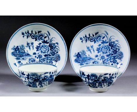 A pair of 18th Century Worcester blue and white porcelain tea bowls and saucers printed with the "Fence" pattern, with blue c