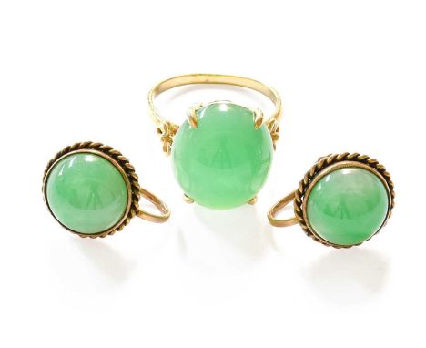 A Pair of Jade Earrings, with screw fittings; and A Jade Ring, stamped '14KT', finger size M1/2
