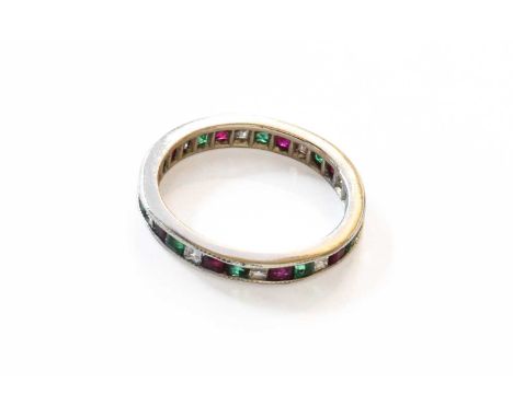 An Emerald, Diamond and Ruby Eternity Ring, unmarked, finger size L1/2The ring is in good to fair condition with slight chips