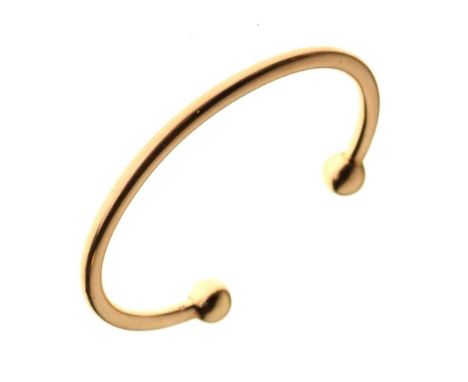 Yellow metal torque bangle, stamped 375, 31.5g approxCondition report: 6.7cm internal width approx **General condition consis