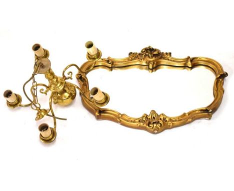 Five branch brass light fitting, together with a gilt-framed mirror