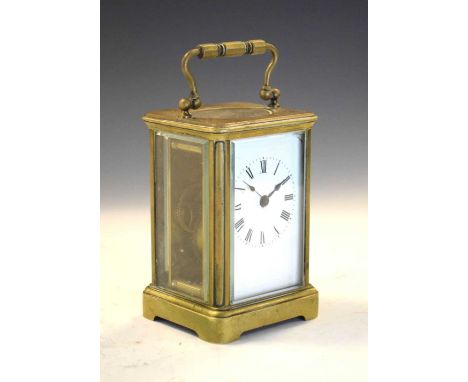 Brass cased carriage clock having white Roman dial, 11cm high