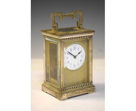 Silver plate on brass cased carriage clock, having white Roman dial, 12cm high approx.