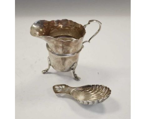 George V Irish silver helmet shaped cream jug, Dublin 1921, 7.3cm high, together with a Queen Elizabeth II caddy spoon, Dubli