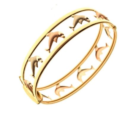 Three-colour gold snap bangle, with dolphin decoration, stamped '750', 16.9g approxCondition report: **General condition cons