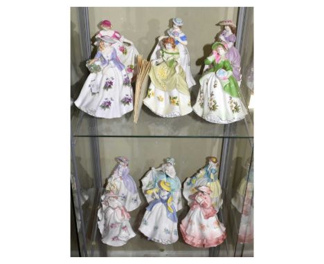 Set of twelve Royal Worcester 'Beauty of Flowers' limited edition figures, 18cm high approx.