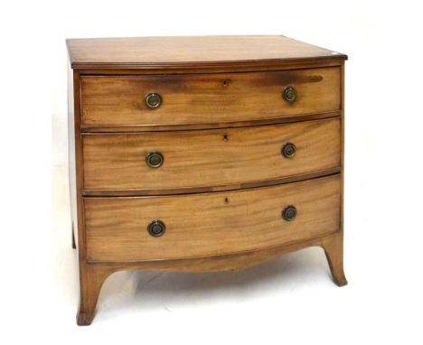 Late George III mahogany bowfront chest of drawers, with reeded edge over three long drawers with circular brass handles on s