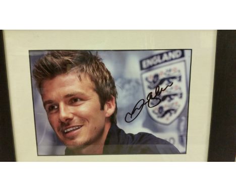 FOOTBALL, signed colour photo by David Beckham, h/s in front of FA emblem, overmounted, framed in perspex, EX