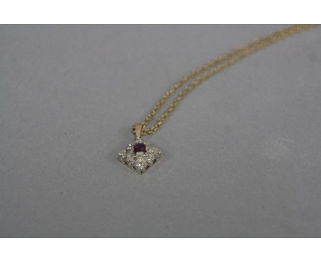 A MODERN RUBY AND DIAMOND SQUARE SHAPE CLUSTER PENDANT, one modern mixed cut ruby, estimated weight 0.35ct, eight cut diamond