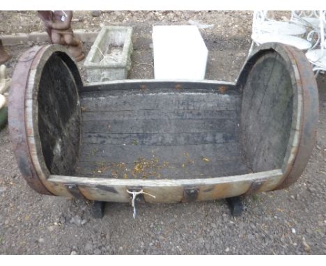 AN OAK HALF BARREL PLANTER